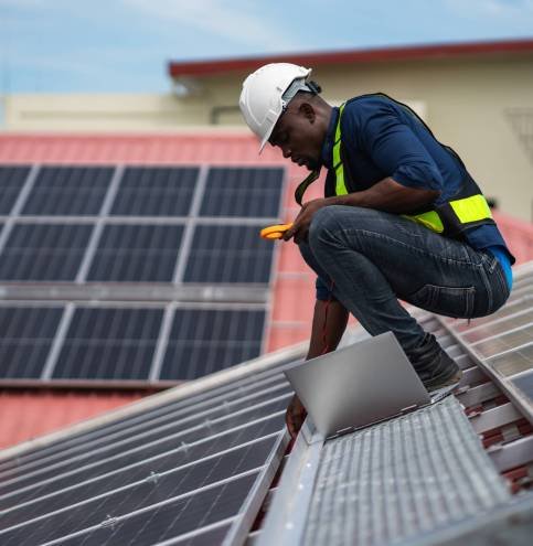 Service engineer checking solar cell on the roof for maintenance if there is a damaged part. Engineer worker install solar panel. Clean energy concept. Service engineer checking solar cell on the roof for maintenance if there is a damaged part. Engineer worker install solar panel. Clean energy concept.